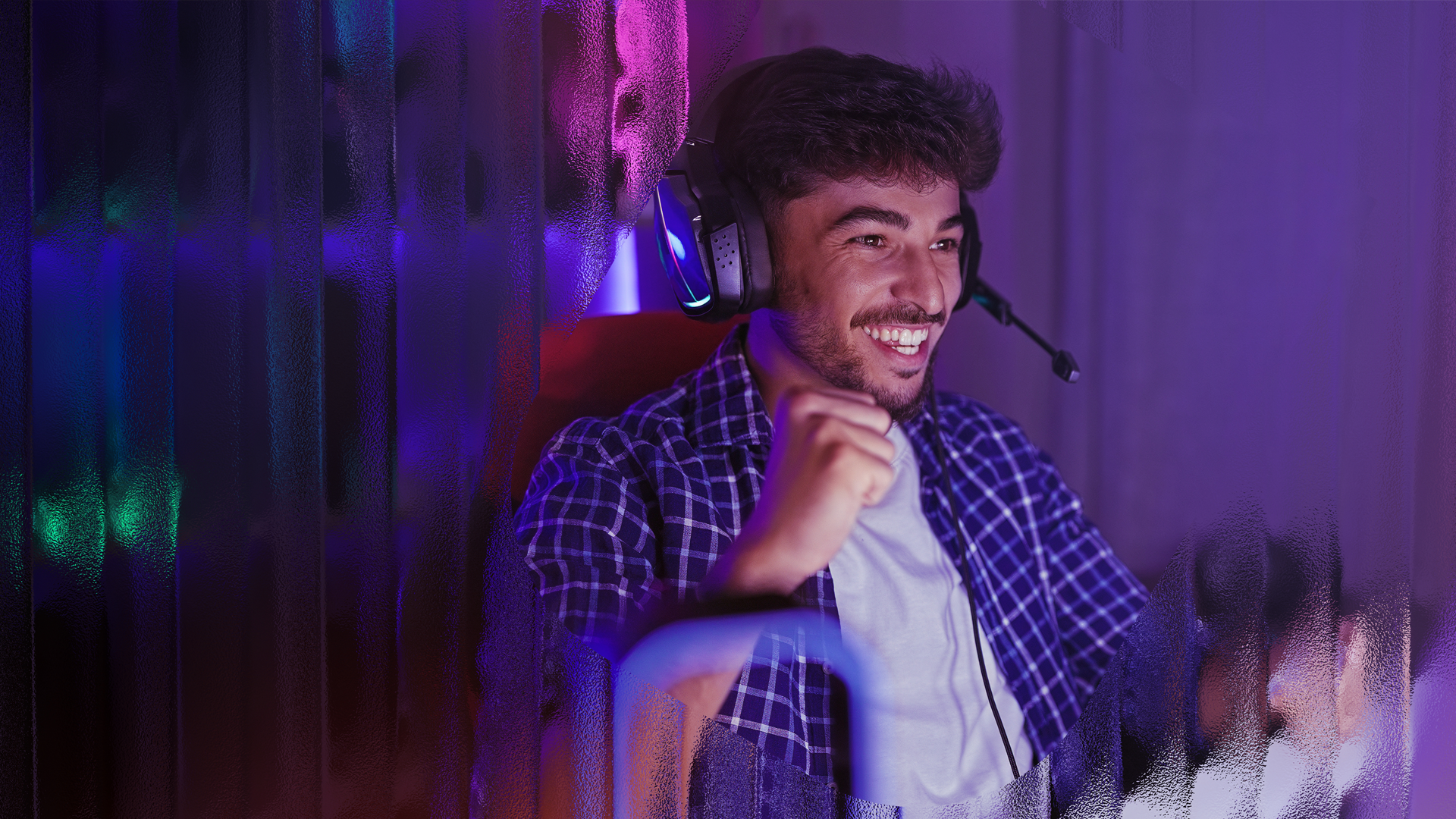 Image of a male playing a video game.