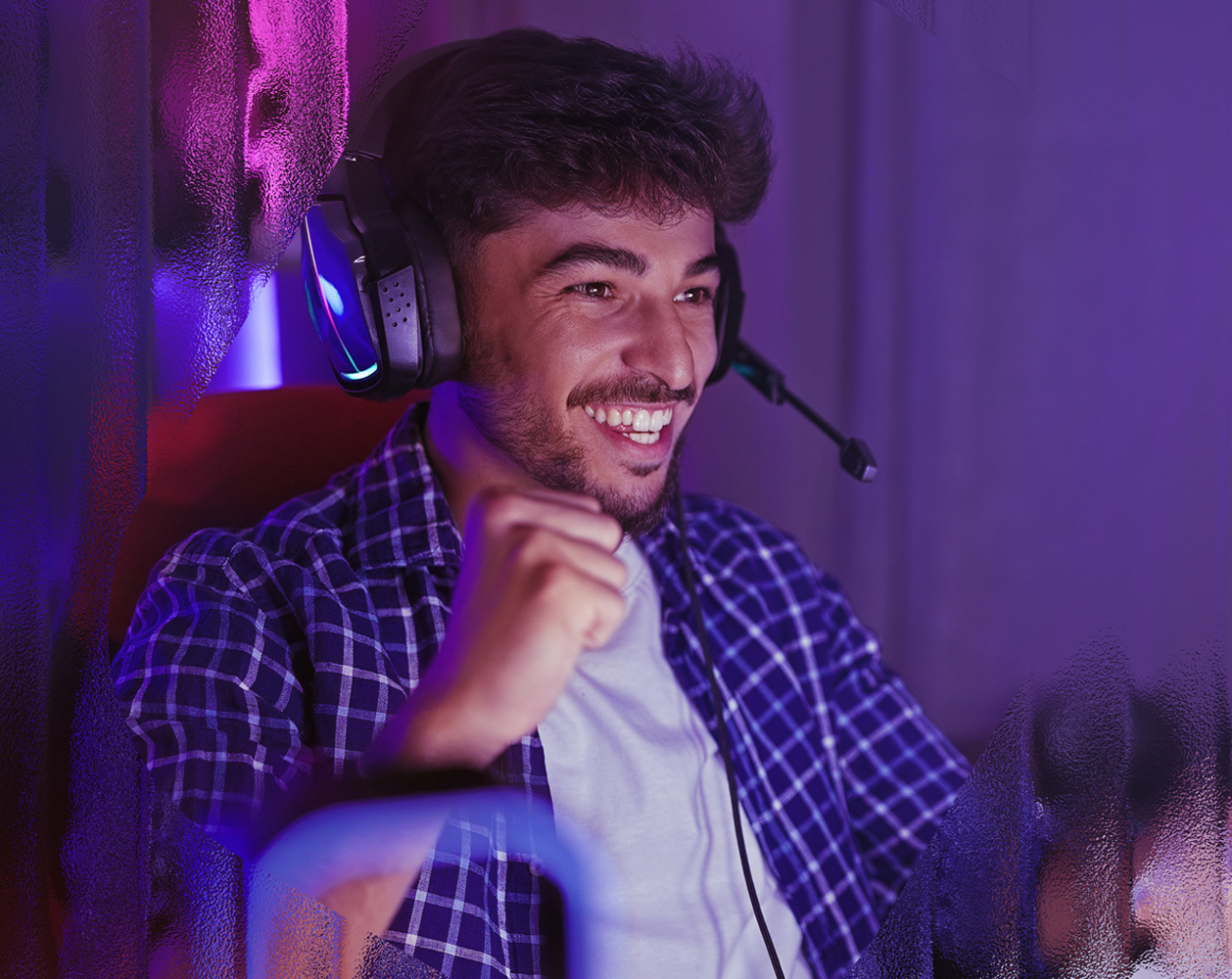 Image of a male playing a video game.