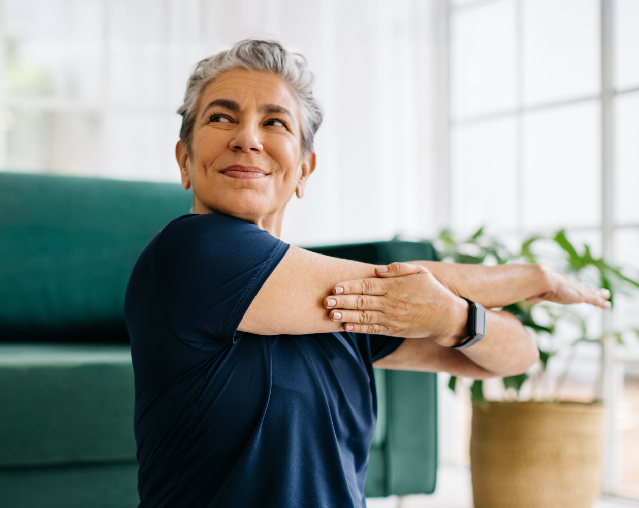 Image of a woman stretching her arms to the side