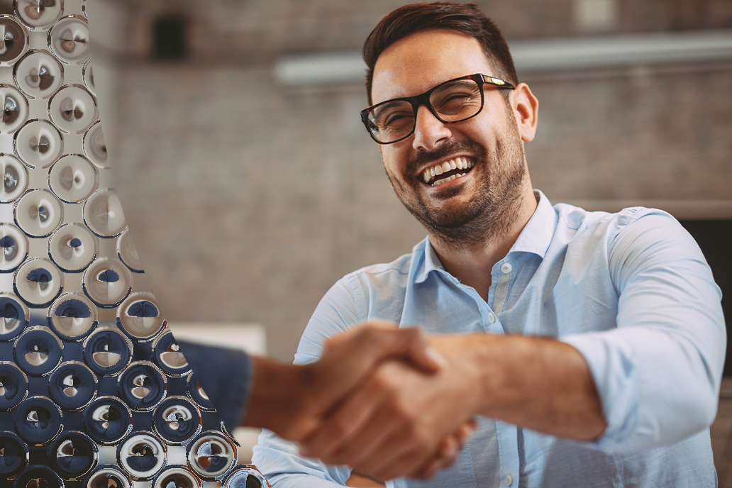 Image of two males shaking hands