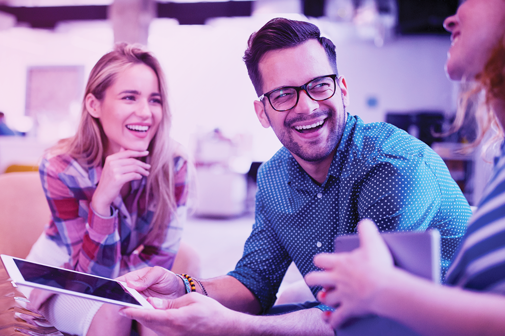 Image of a man talking to his colleagues
