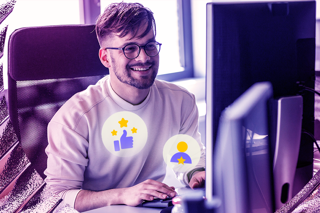 Image of a happy man looking at his desktop