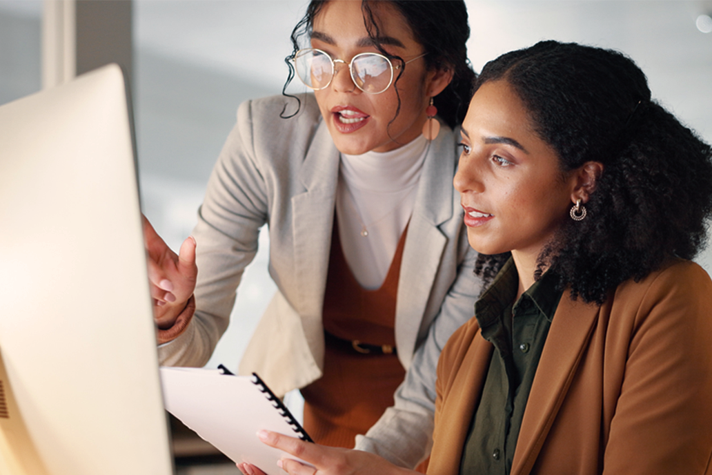 Two female colleagues talking