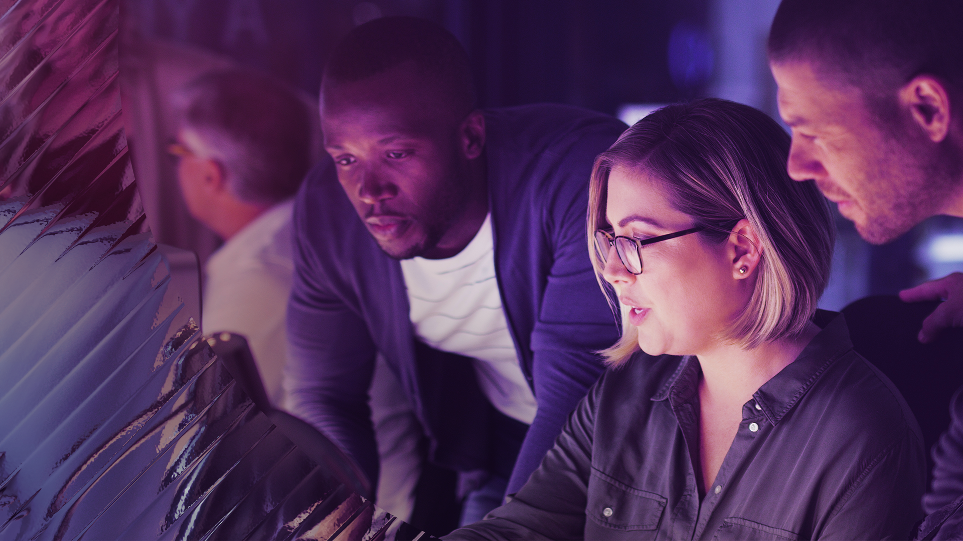 Image of a group of smart individuals looking at a monitor
